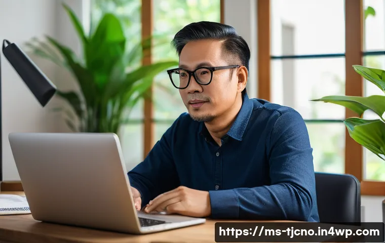 디지털 기기의 부정적 영향 줄이기 - A middle-aged Malaysian man sitting at a wooden desk in a cozy home office with warm, balanced light...