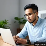 Home 18 테크노스트레스와 주의력 결핍 - A focused Malay man sitting at a clean, organized wooden desk in a quiet, bright room with natural d...